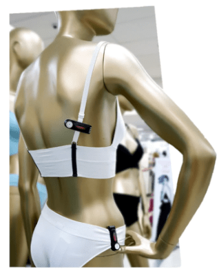 Security tag being used in a Farmers store on clothing