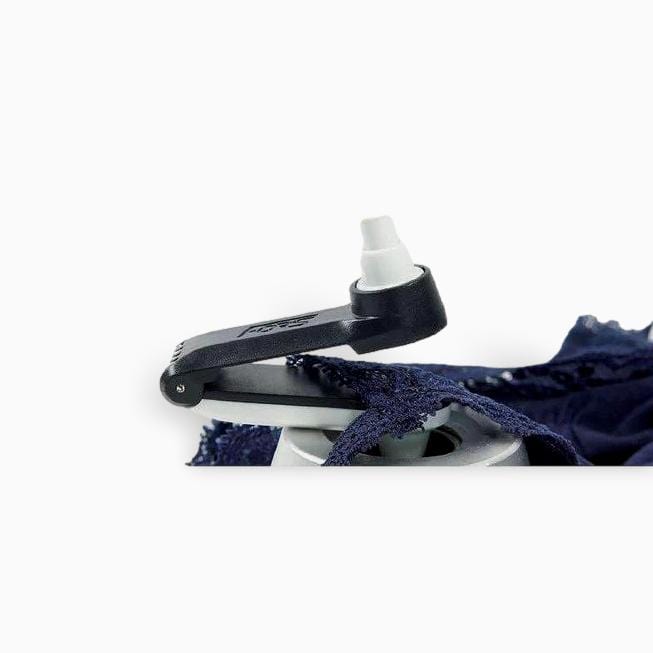 Innovative Forstag Ink Tag hanging safely on a bra strap with quick-release mechanism.