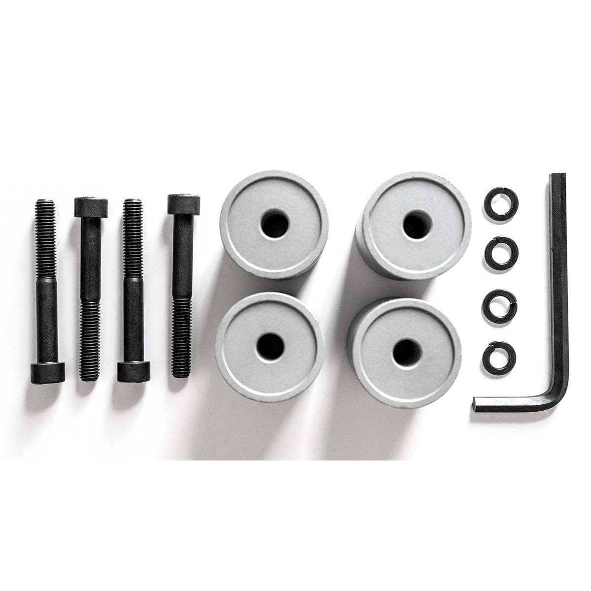 Microsoft Surface Hub Wall Mount Adapter Kit components laid out, showing universal spacer pieces.