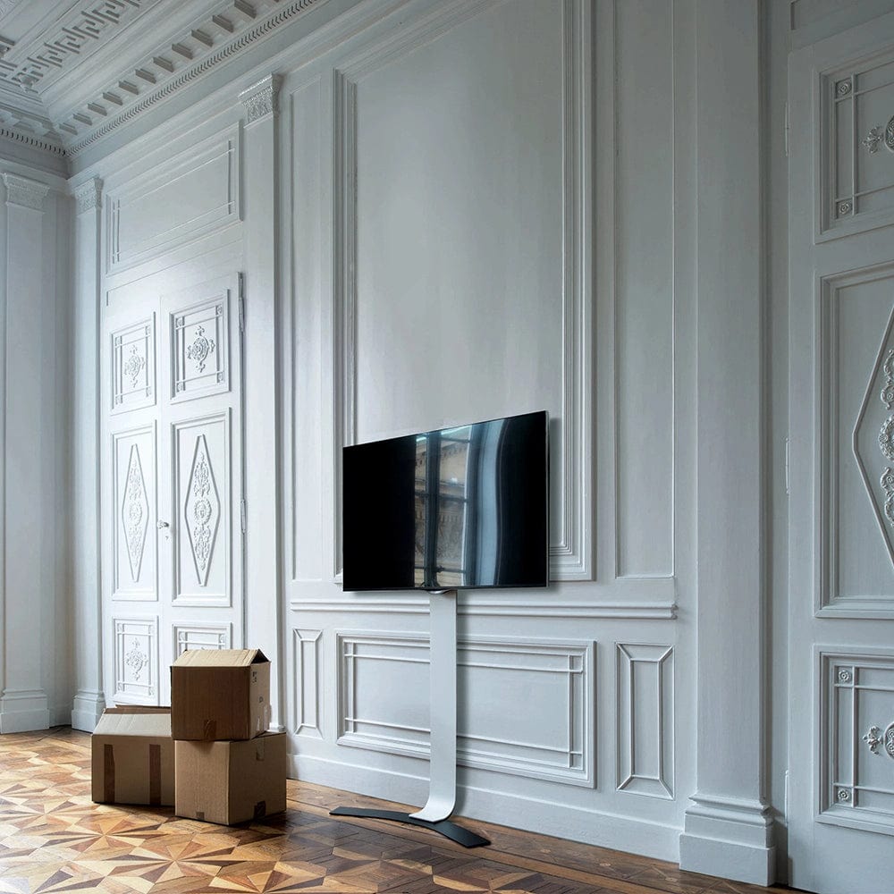 Side view of the TV mounted on the wall, highlighting the slim profile, adjustable height mechanism, and anti-fall safety device.