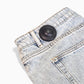 Mitag MiTag 50 security tag on garment, discreet and secure for clothing retail theft prevention.