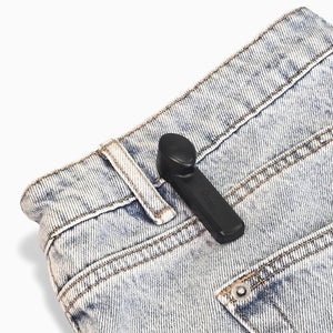 Mitag Pencil with pin on jeans, secure anti-theft tag for apparel and denim protection.