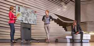 Side view showing cable management, storage compartments, and durable casters for easy transport.